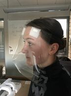 Face shield on a girl. Photo.